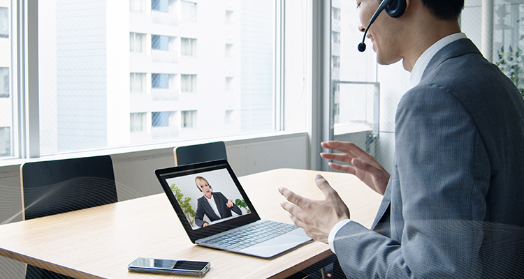 employee videoconferencing with woman online